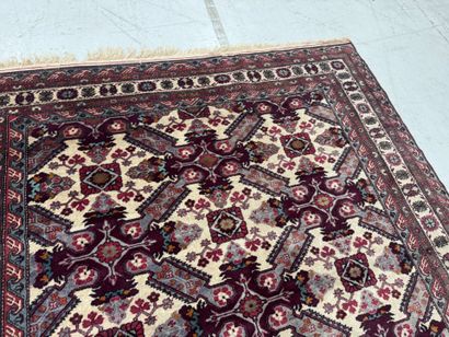 IRAN.
Hand-knotted wool rug with stylized...