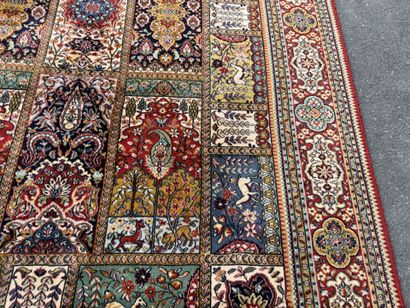 Large, multicolored machine-woven rug featuring...