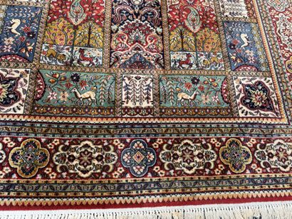 Large, multicolored machine-woven rug featuring...