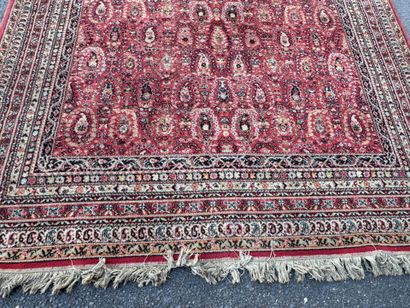 Hand-knotted wool rug with a decorative design...