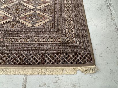 Large machine-woven wool rug featuring geometric...