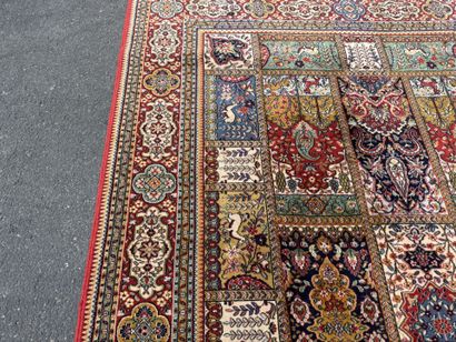 Large, multicolored machine-woven rug featuring...