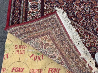 Large machine-woven rug made of multicolored...