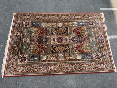 Large, multicolored machine-woven rug featuring...
