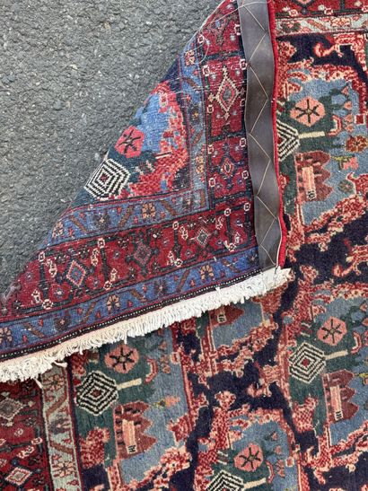 Hand-knotted wool rug with a landscape design.
158...