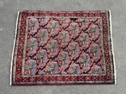 Hand-knotted wool rug with a landscape design.
158...