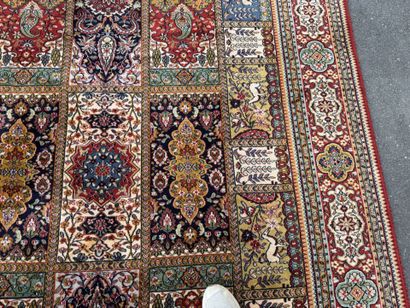 Large, multicolored machine-woven rug featuring...