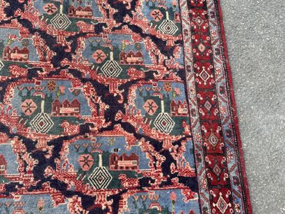 Hand-knotted wool rug with a landscape design.
158...