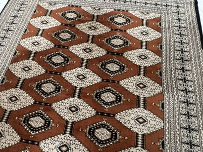 Large machine-woven wool rug featuring geometric...