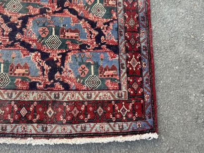 Hand-knotted wool rug with a landscape design.
158...