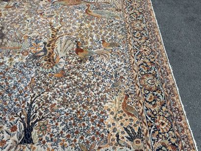 A significant hand-knotted wool rug featuring...