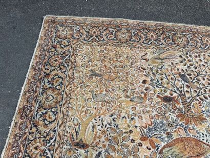 A significant hand-knotted wool rug featuring...