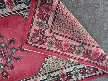 Hand-knotted wool gallery rug with a decorative...