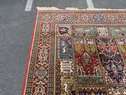 Large, multicolored machine-woven rug featuring...