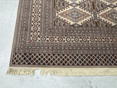 Large machine-woven wool rug featuring geometric...
