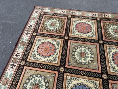 Large, multicolored machine-woven rug featuring...