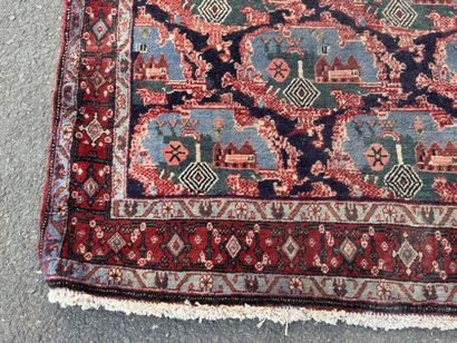 Hand-knotted wool rug with a landscape design.
158...
