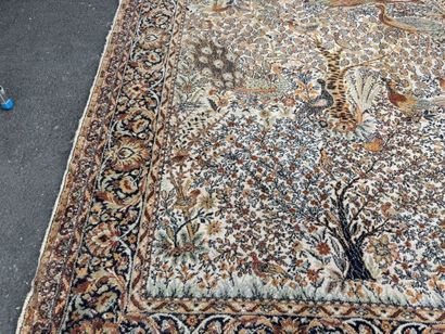 A significant hand-knotted wool rug featuring...
