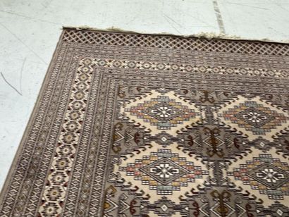 Large machine-woven wool rug featuring geometric...