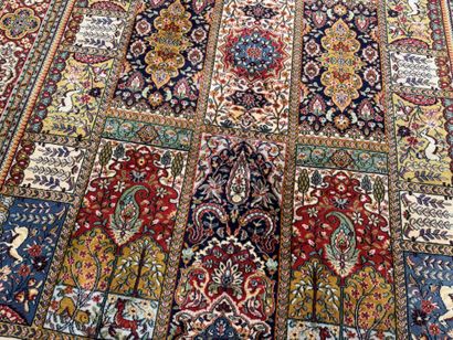 Large, multicolored machine-woven rug featuring...
