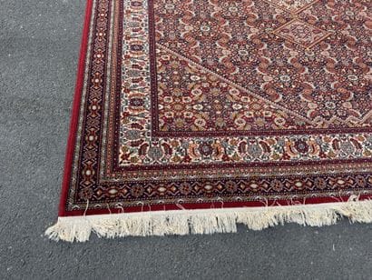 Large machine-woven rug made of multicolored...