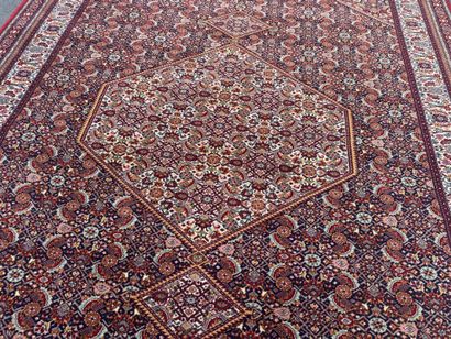 Large machine-woven rug made of multicolored...