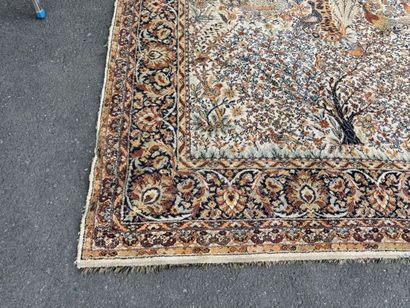 A significant hand-knotted wool rug featuring...