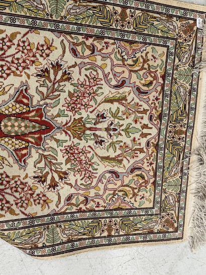 Small wool and silk rug with a leaf-and-vine...