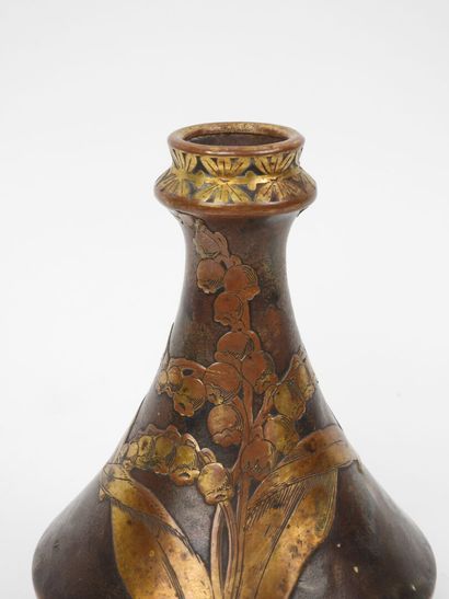 Porcelain vase with a flattened body, featuring...