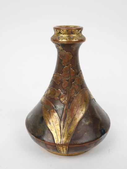 Porcelain vase with a flattened body, featuring...