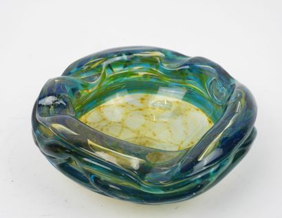 Circular ashtray made of blue- and yellow-tinted...