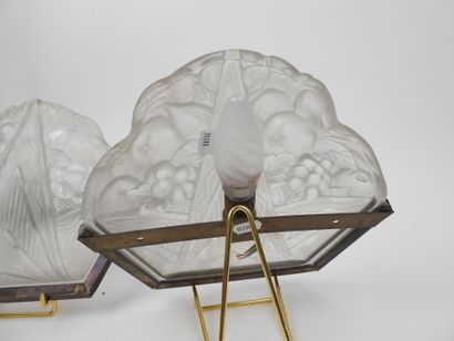 Pair of molded glass wall sconces with a...