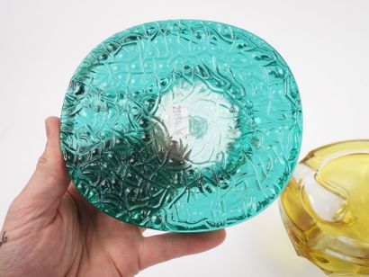 Two ashtrays made of yellow and green tinted...