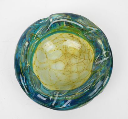 Circular ashtray made of blue- and yellow-tinted...