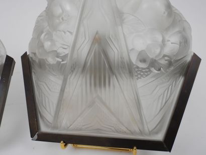 Pair of molded glass wall sconces with a...