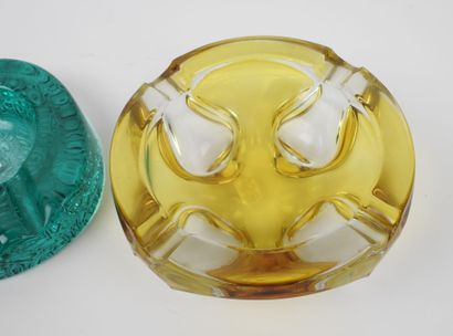 Two ashtrays made of yellow and green tinted...