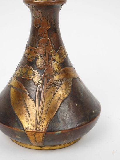 Porcelain vase with a flattened body, featuring...