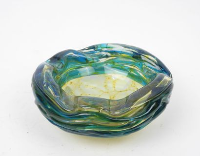 Circular ashtray made of blue- and yellow-tinted...