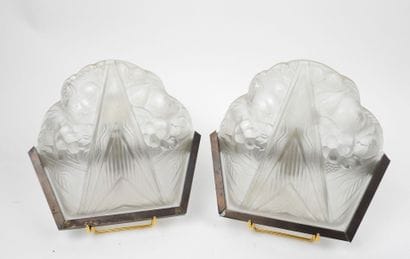 Pair of molded glass wall sconces with a...