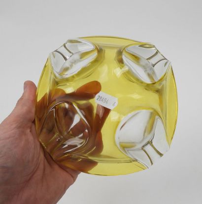 Two ashtrays made of yellow and green tinted...