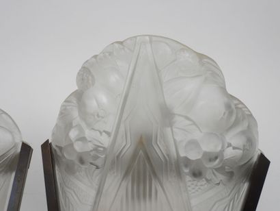 Pair of molded glass wall sconces with a...