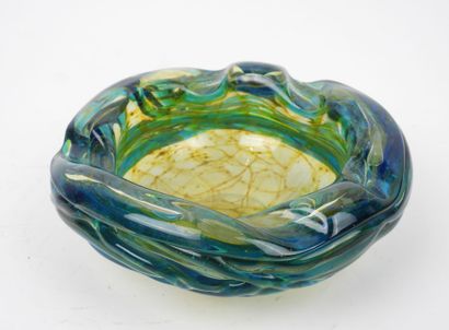 Circular ashtray made of blue- and yellow-tinted...