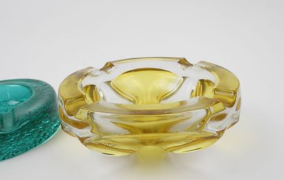 Two ashtrays made of yellow and green tinted...