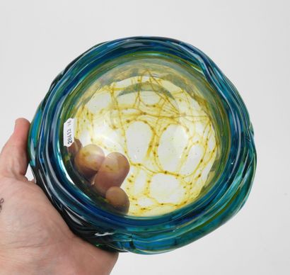 Circular ashtray made of blue- and yellow-tinted...