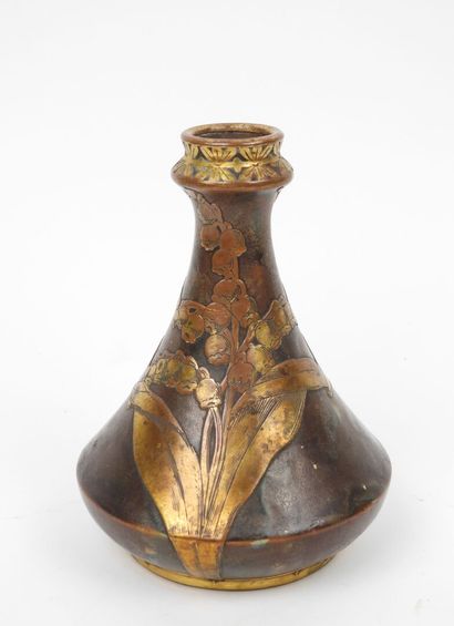 Porcelain vase with a flattened body, featuring...