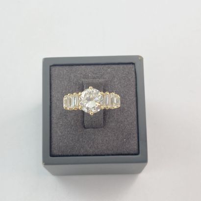Gold ring with white stones** (round and...