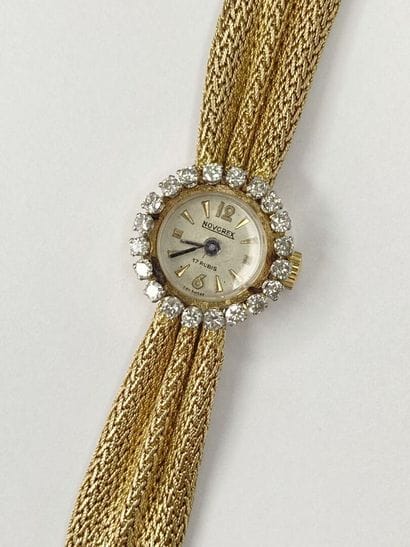 Montre dame or de marque Novcrex, pierres**...