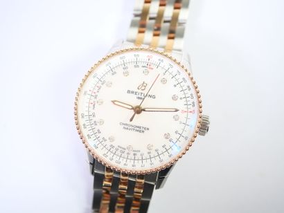 BREITLING. 
Montre-bracelet en acier et or...