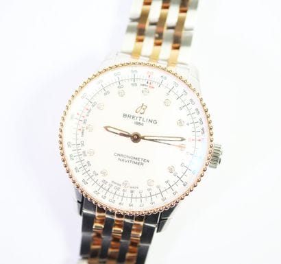 BREITLING. 
Montre-bracelet en acier et or...