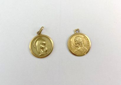 2 gold medals inscribed with 